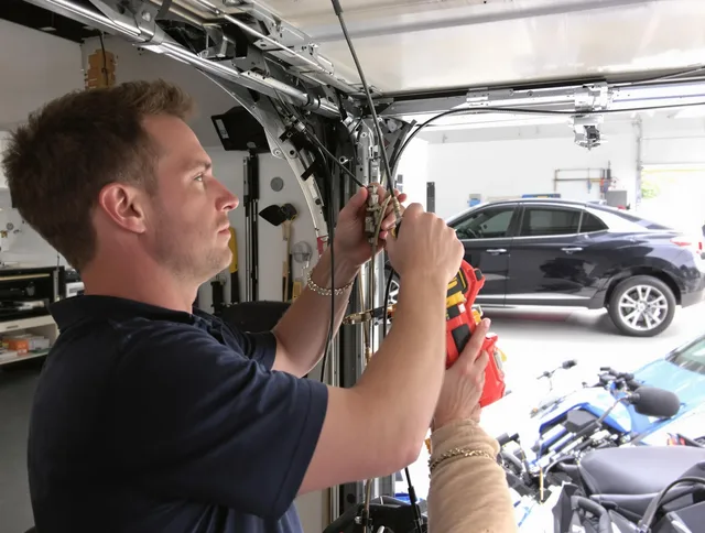 Jurupa Valley Garage Door Repair safety certified technician performing cable replacement in Jurupa Valley
