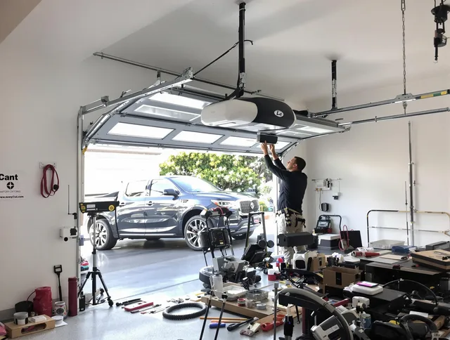 Jurupa Valley Garage Door Repair specialist installing smart garage door opener system in Jurupa Valley home